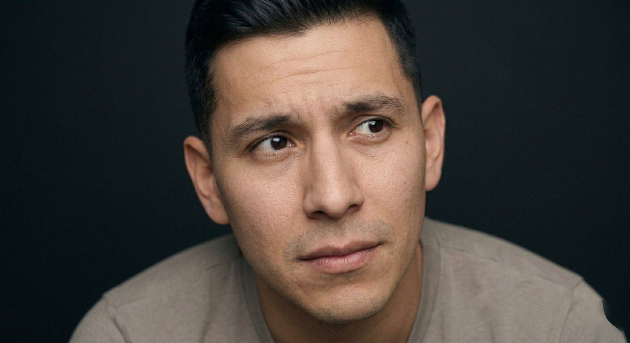 A man's face showing distraction: gaze drifting to one side, attention elsewhere.