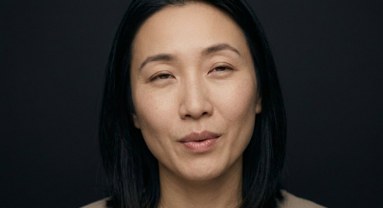A woman's face showing relief: a soft relieved smile and eyes easing, tension let go.